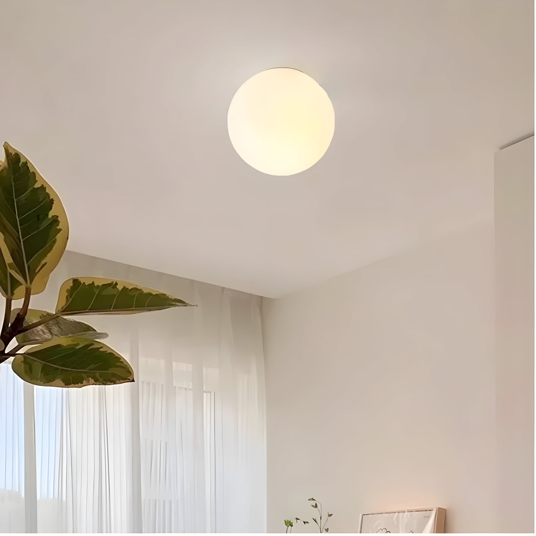 GlasAura Wall Lamp with Matte Glass Ball and Metal Base | Bowlift