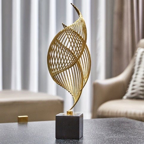 Golden abstract shell sculptures Bowlift