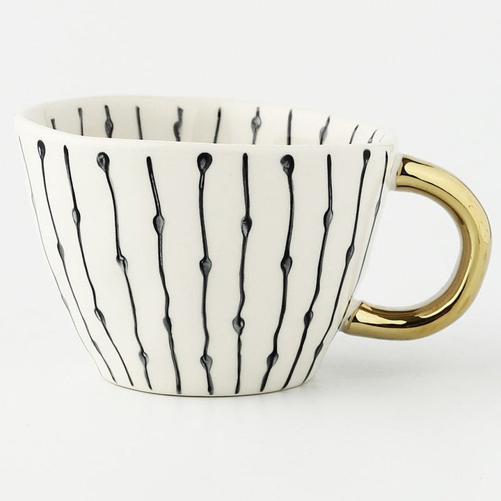 BowLift | Cup with abstract geometric pattern and gold handle
