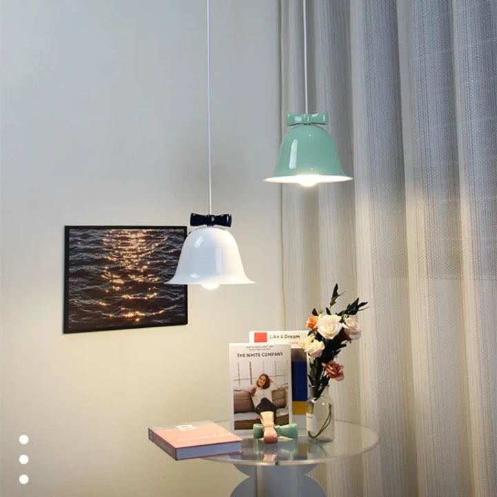 Modern bell-shaped pendant light with bow, designer hanging lamp for dining room & kitchen | Bowlift