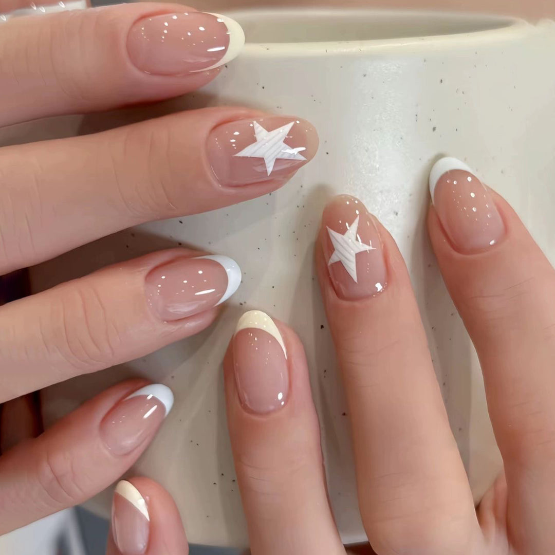 Elegant artificial nails with classic French tip and intricate star design Bowlift