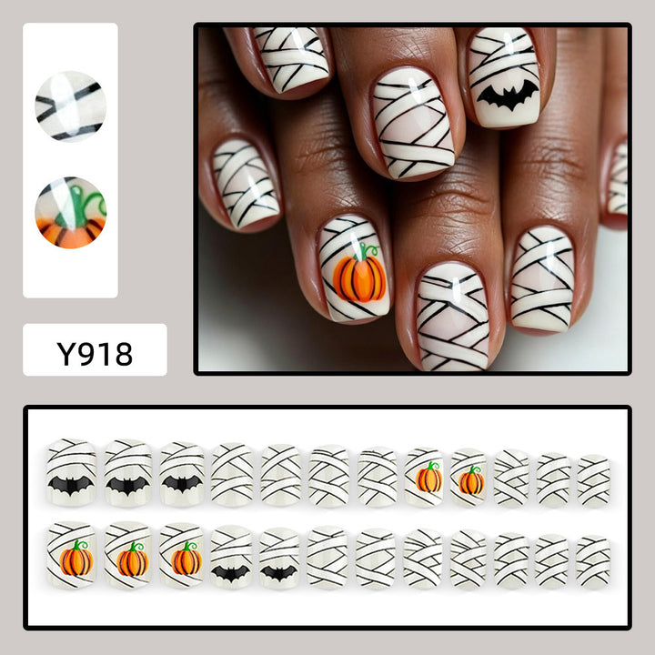 Creative Halloween Nail Art with Pumpkin and Bat Design Bowlift