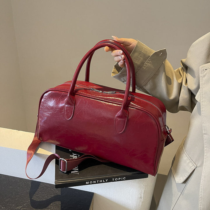 Elegant and Spacious Weekend Bag Made of High-Quality Synthetic Leather Bowlift
