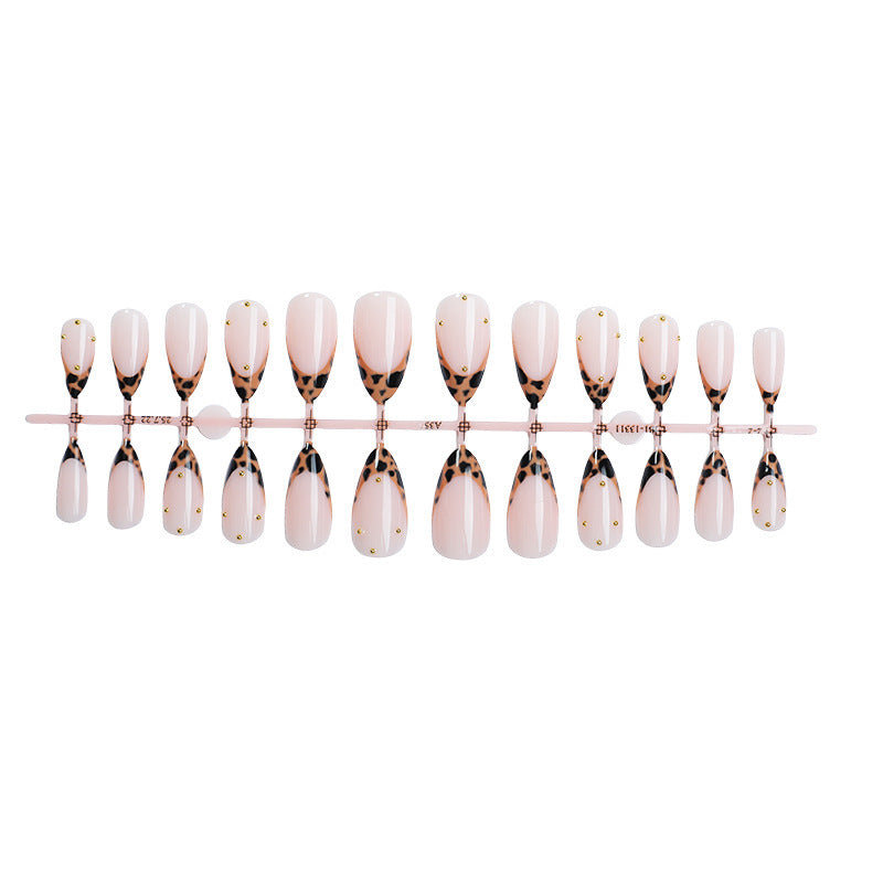 Acrylic nail set with elegant leopard design and gold accents Bowlift
