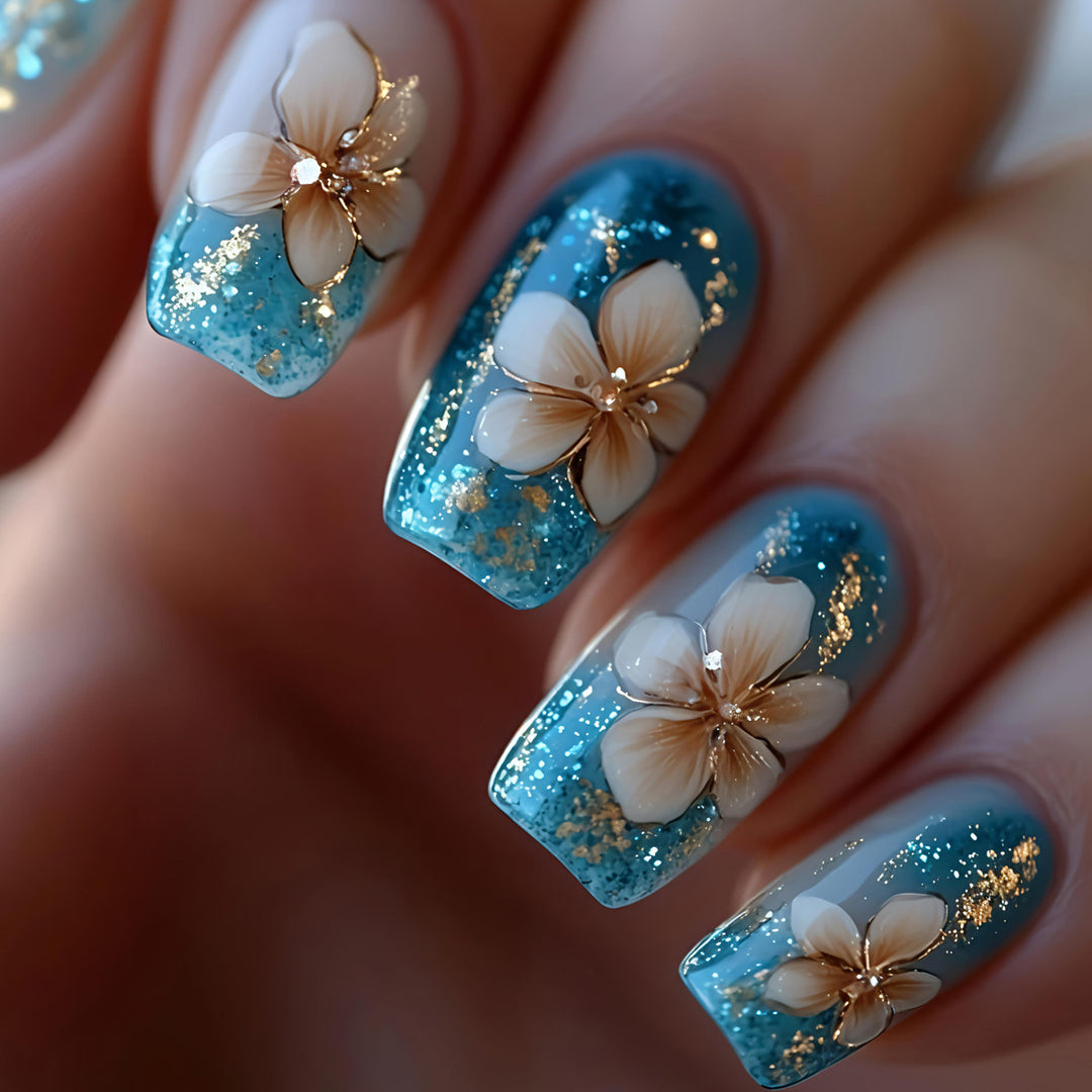 Artificial nails with floral accents and glitter patterns Bowlift