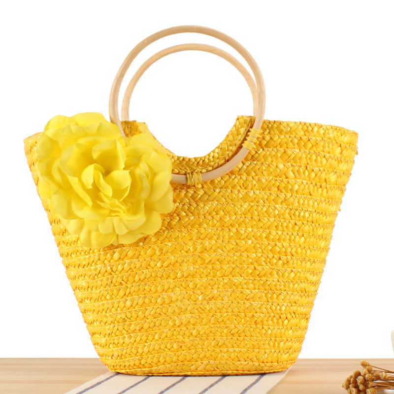 Braided straw bag with floral accent Bowlift