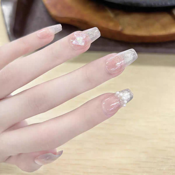 Artistic Press-On Nail Set with Bow and Gemstone Detail Bowlift