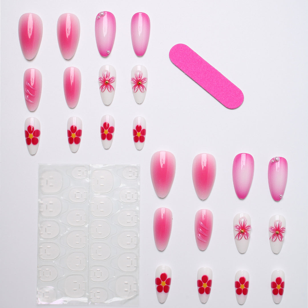 Artificial nail set with delicate flower designs and shimmering accents Bowlift