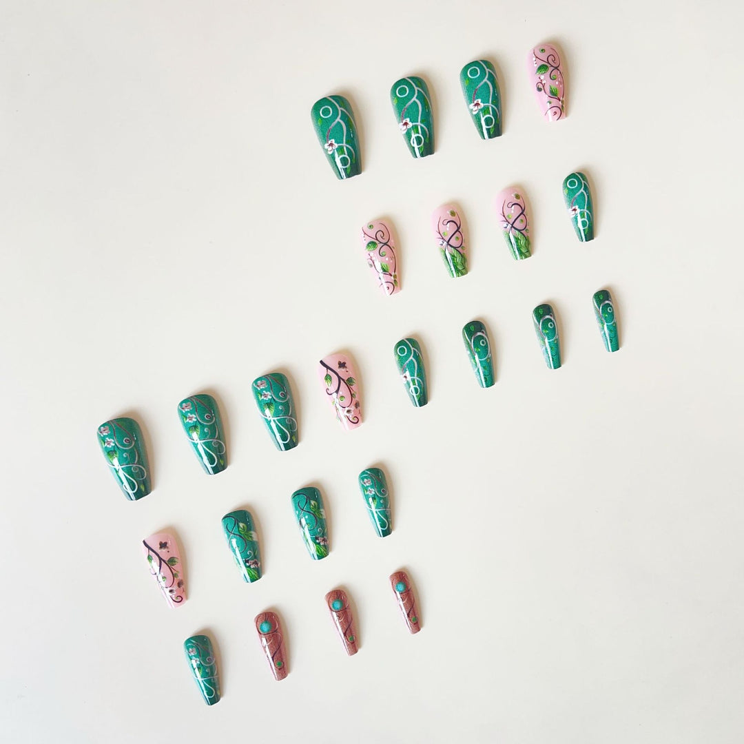 luxurious artificial nail set with floral designs and detailed accents Bowlift