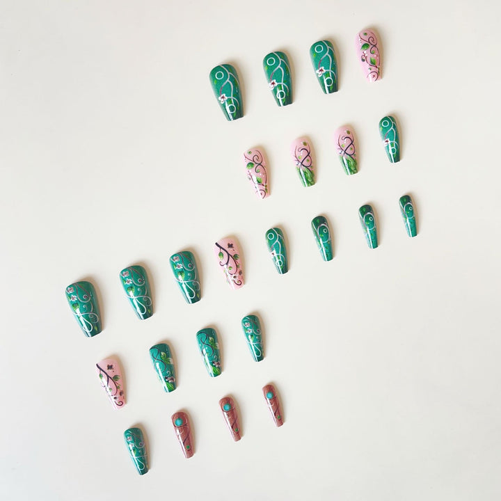 luxurious artificial nail set with floral designs and detailed accents Bowlift