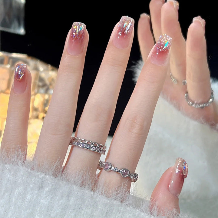 Artificial nails with glitter accents and playful motifs Bowlift