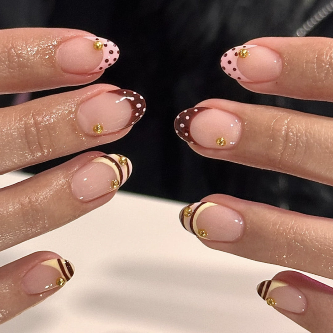 Artful stiletto nails with elegant floral design and glitter details Bowlift