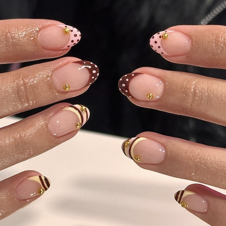 Artful stiletto nails with elegant floral design and glitter details Bowlift