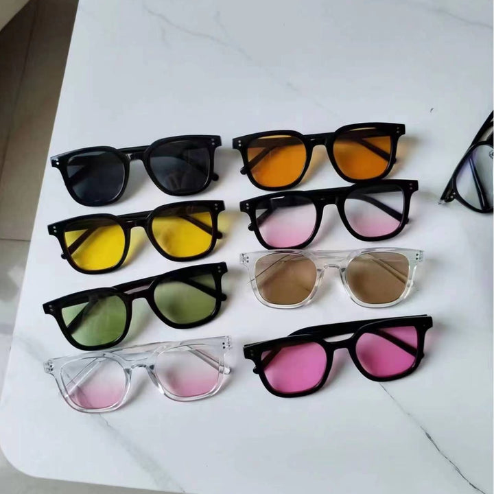 Women striking retro sunglasses with yellow-tinted lenses Bowlift