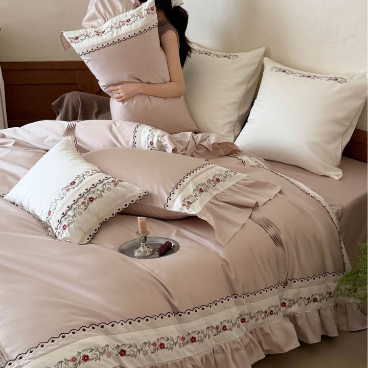 Luxurious embroidered bedding set with ruffles and satin