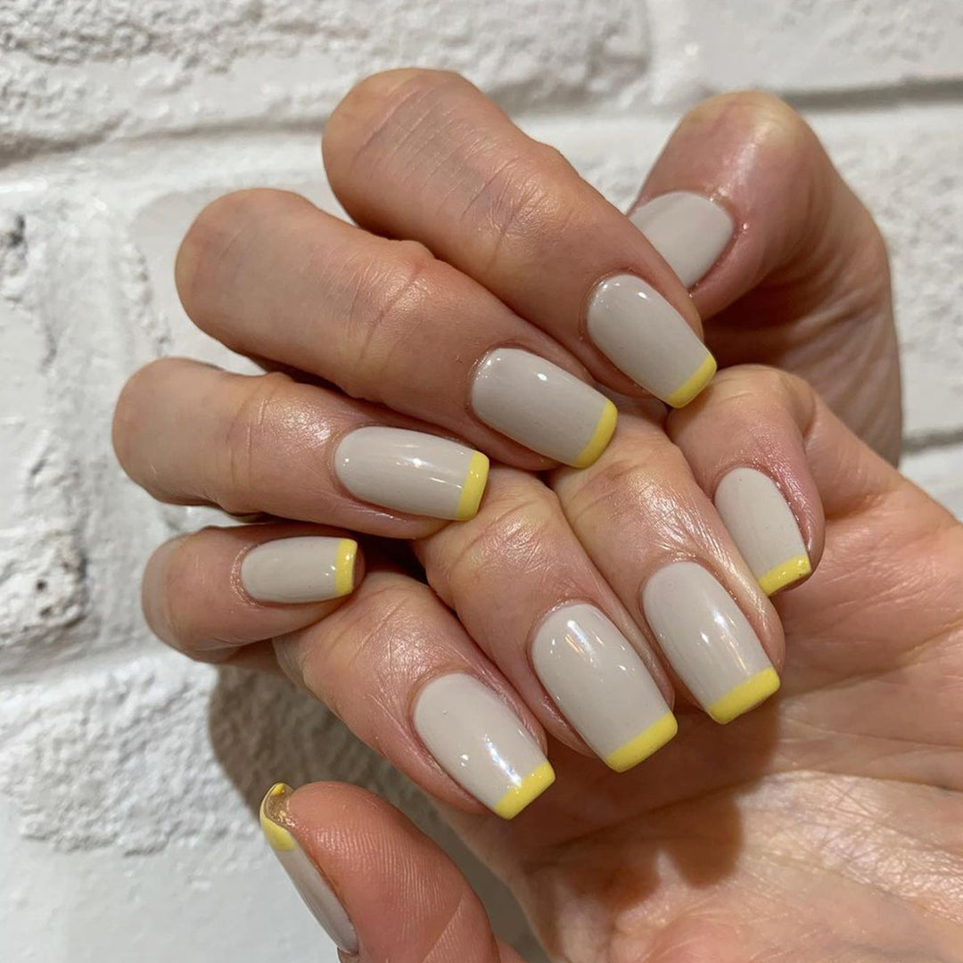 Artistic nail extensions with modern French-tip design Bowlift