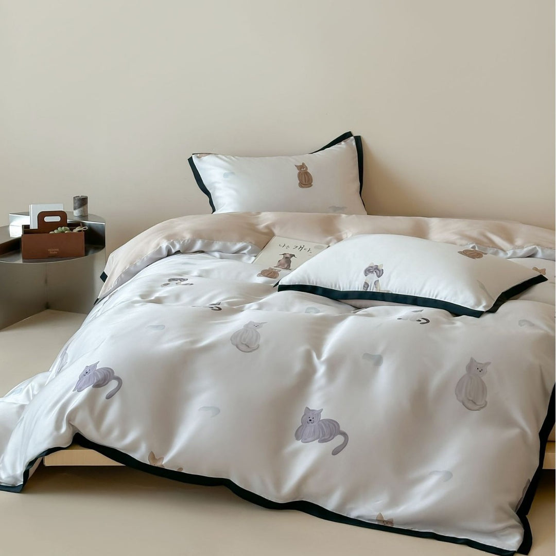 Silk-gloss satin bedding set with minimalist cat illustrations and fine piping