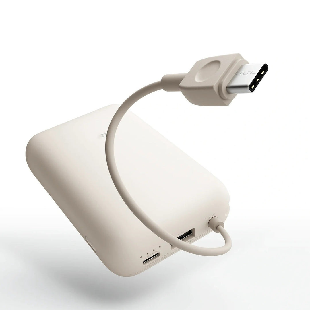 Compact High-capacity portable power bank with integrated USB-C cable and silicone carry loop Bowlift