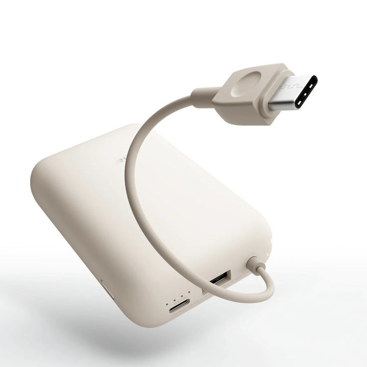 Compact High-capacity portable power bank with integrated USB-C cable and silicone carry loop Bowlift