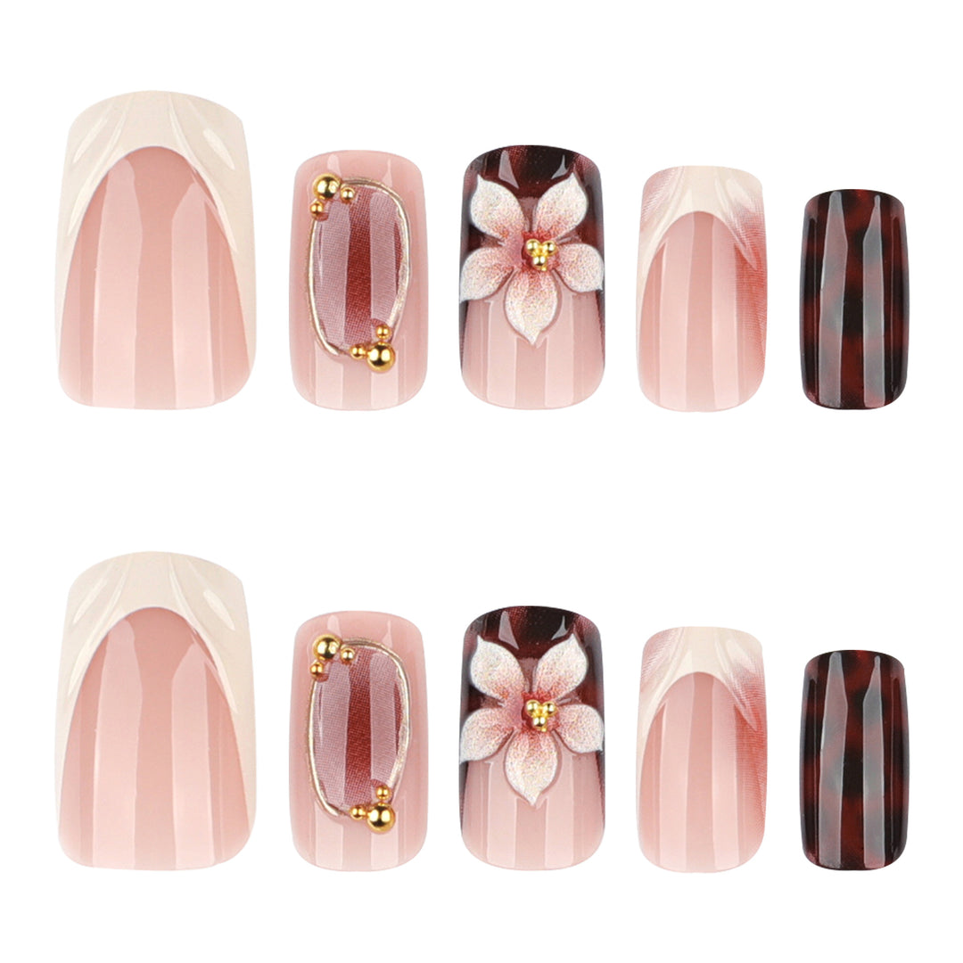Artistic stiletto nails with elegant floral design and glitter effects Bowlift