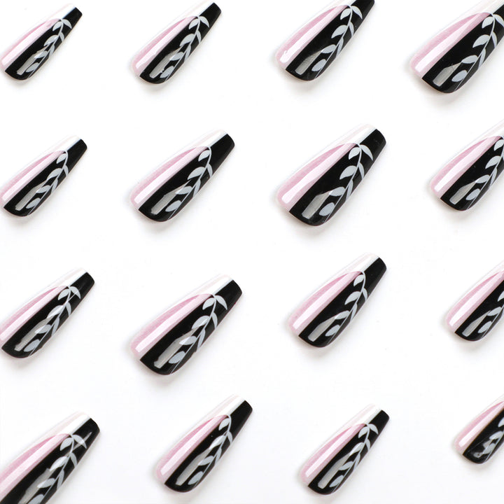 Artful nail extensions in elegant black and white design Bowlift