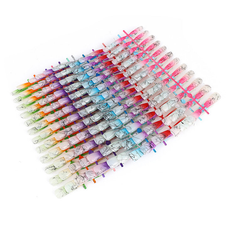 Artificial nails in modern ombre design with marbled accents Bowlift
