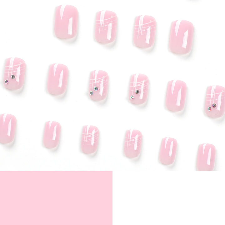 Artful nail extensions with elegant design and rhinestone embellishments Bowlift