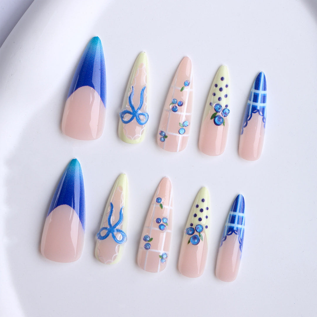 Artificial nails with playful design and elegant accents Bowlift