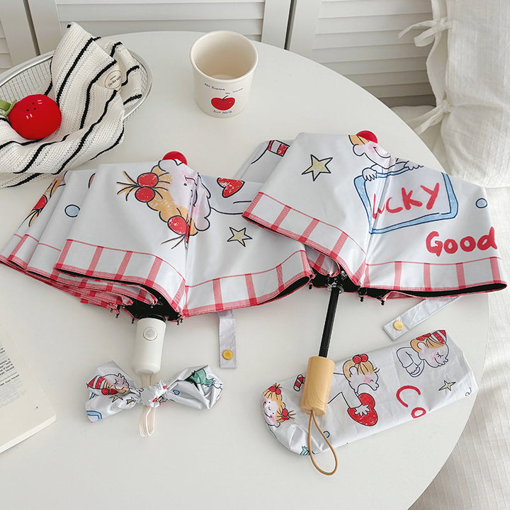Ladies folding umbrella with playful children's motif Bowlift