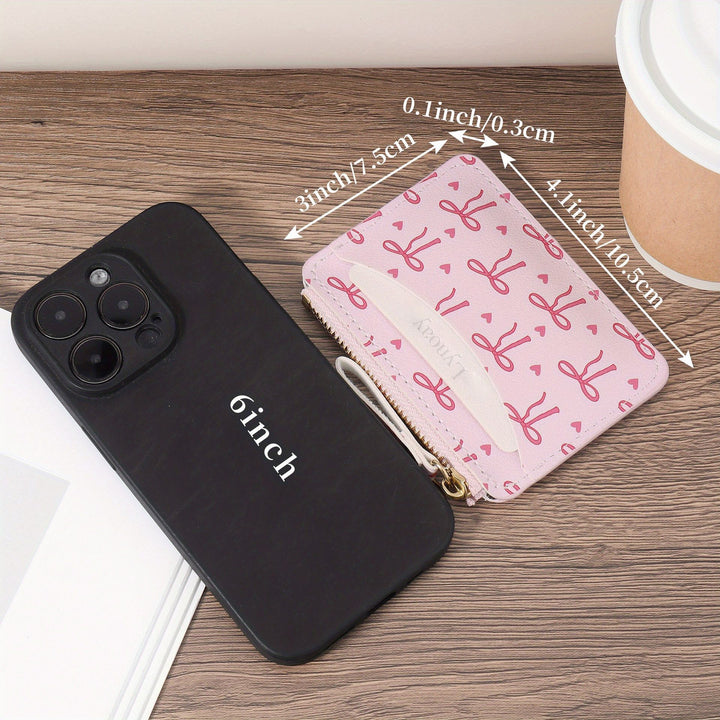 Compact bow-print coin purse wristlet with zipper closure Bowlift