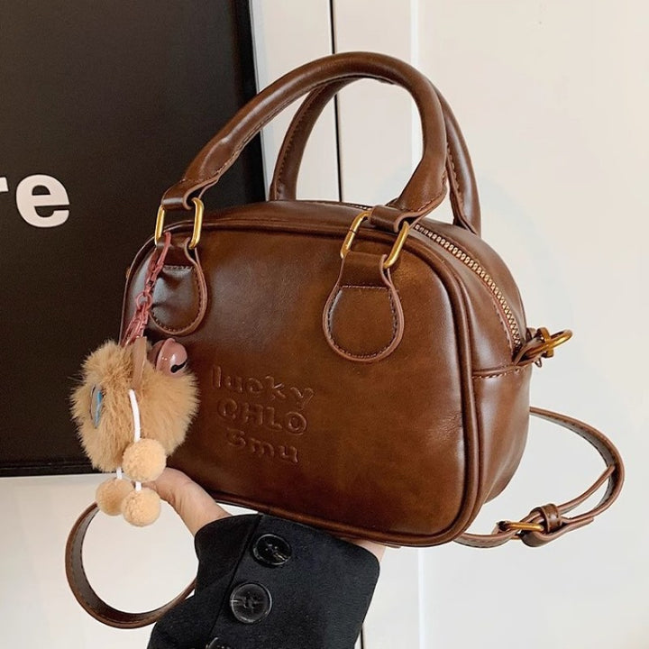 Vintage-Inspired Structured Handbag Bowlift