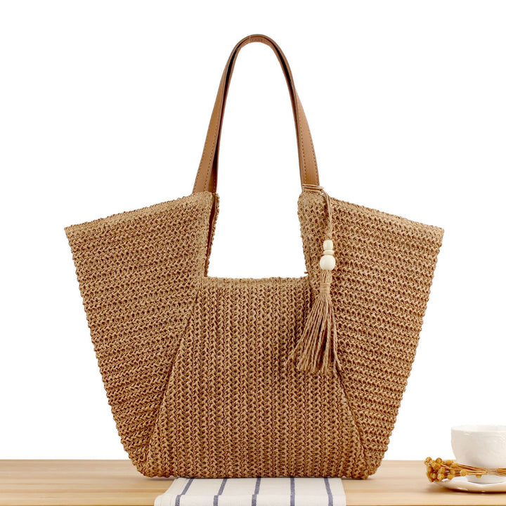 Beach bag made of natural weave with elegant leather accents Bowlift