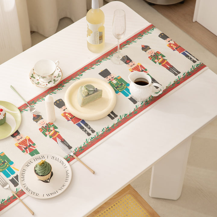 Festive woven table runner with nutcracker motif and golden fringes Bowlift