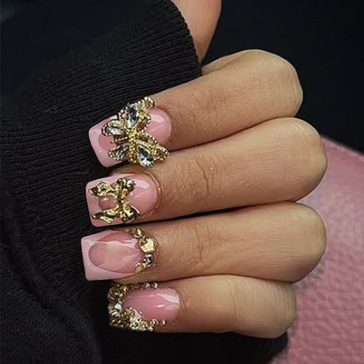 Glamorous artificial nail set with floral accents and glitter decorations Bowlift