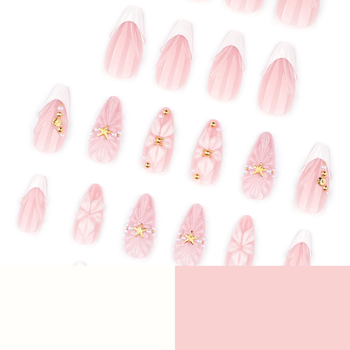 Artful nail art with shell and flower accents Bowlift