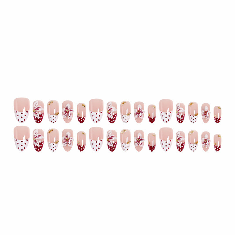 Artificial nail set with floral design and golden accents Bowlift
