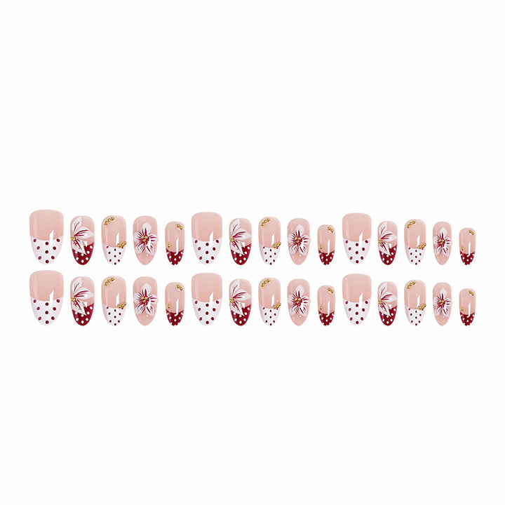 Artificial nail set with floral design and golden accents Bowlift