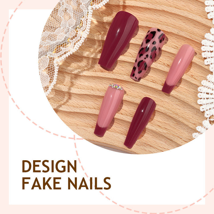Artificial nail set with elegant animal print and glitter accents Bowlift