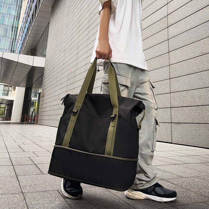 Sporty shoulder bag with water-repellent material and sturdy carrying handles Bowlift