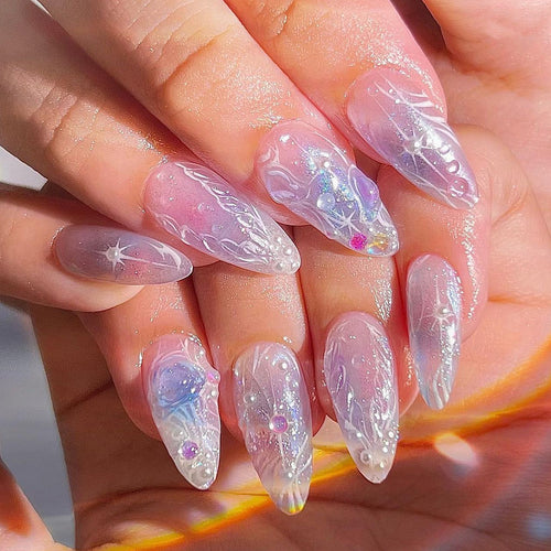 Artful nail extensions in an elegant design with gloss accents Bowlift