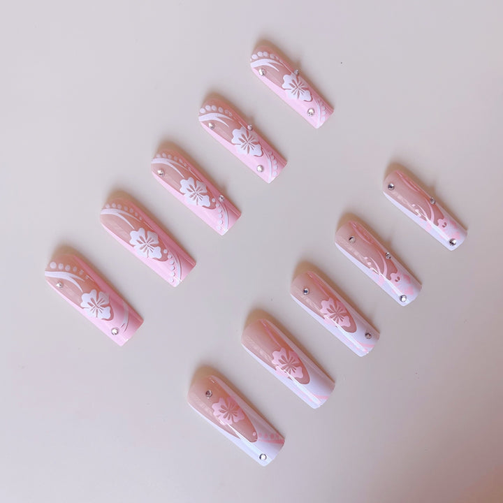 Art nail set with elegant flower design and crystal embellishments Bowlift