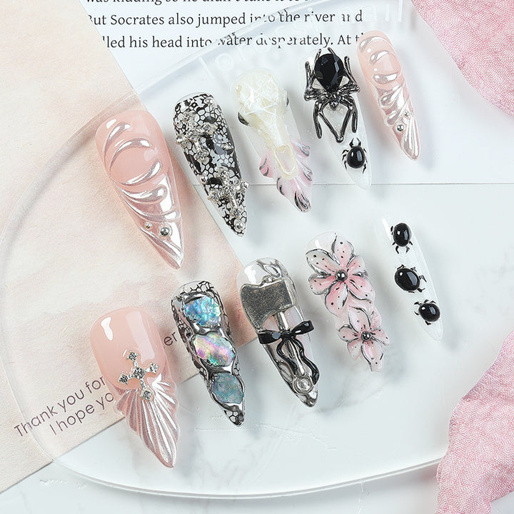 Creative nail art set with Halloween motifs and intricate details Bowlift
