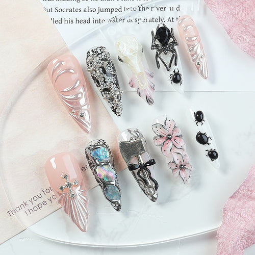 Creative nail art set with Halloween motifs and intricate details Bowlift