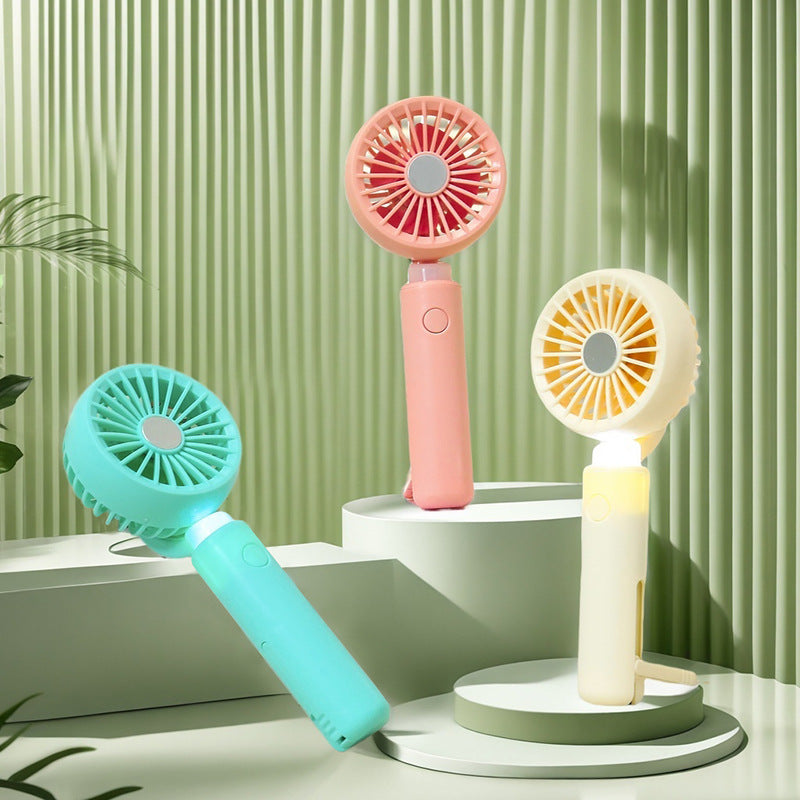 Women portable mini hand fan with integrated LED lighting and USB charging function Bowlift