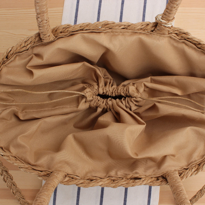Fashionable basket bag with elegant tassel design Bowlift