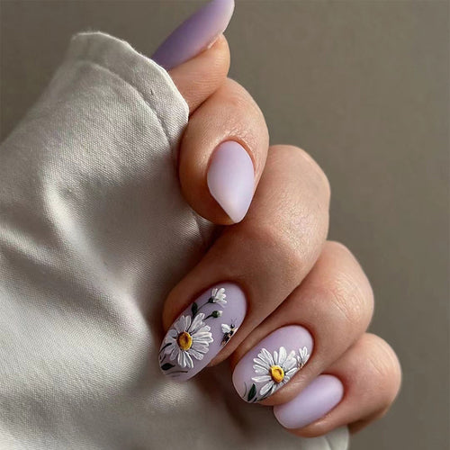 Artistic nail design with delicate floral elements Bowlift