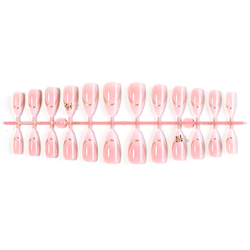 Artificial nail set with elegant gold edge and decorative accents Bowlift