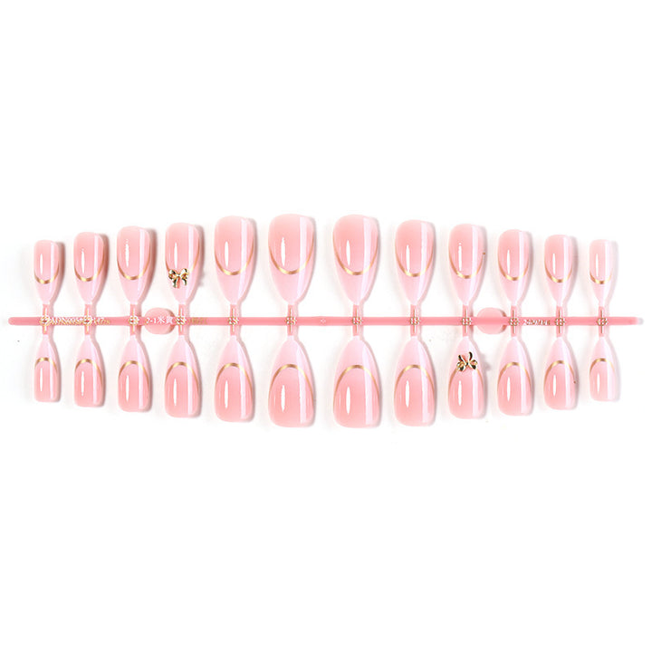 Artificial nail set with elegant gold edge and decorative accents Bowlift