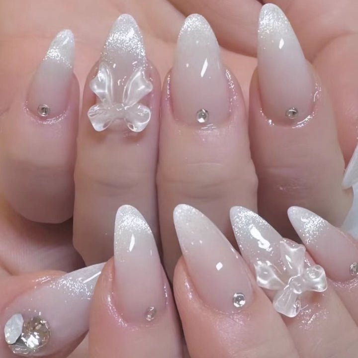 Elegant Stiletto Press-On Nails with Decorative Bow and Gemstone Accents Bowlift
