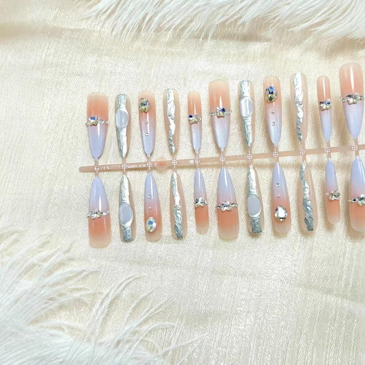 Artificial nails with elegant glitter and crystal accents Bowlift